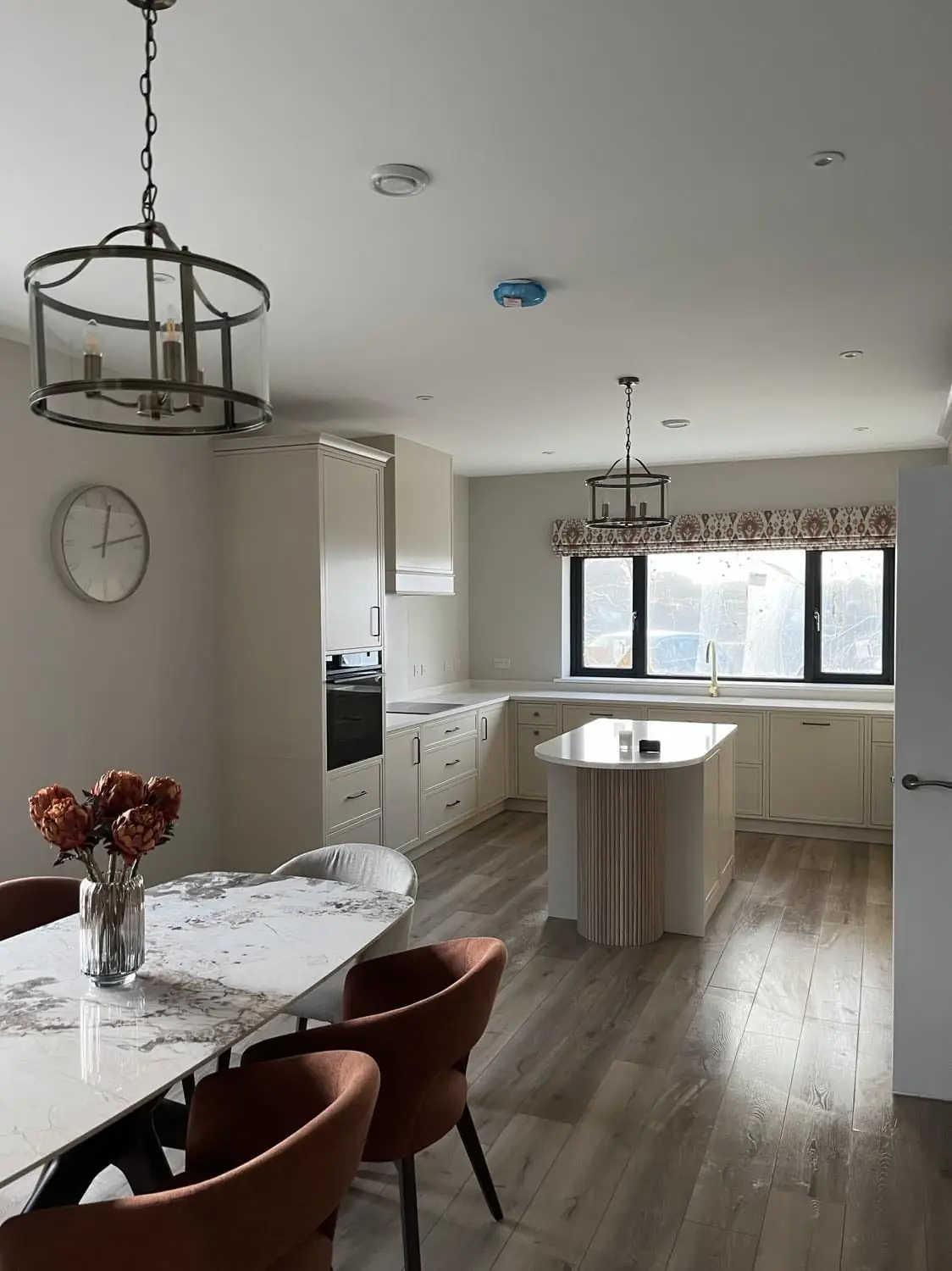 Complete kitchen transformation with professionally repainted cabinets by MS Partners